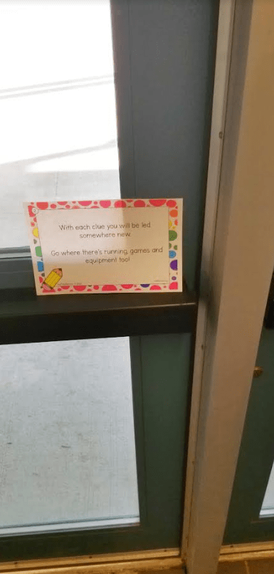 free school scavenger hunt shows a clue card on a door.