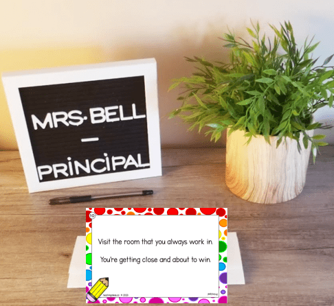 classroom escape room shows a sign for mrs. bell principal and a clue card.