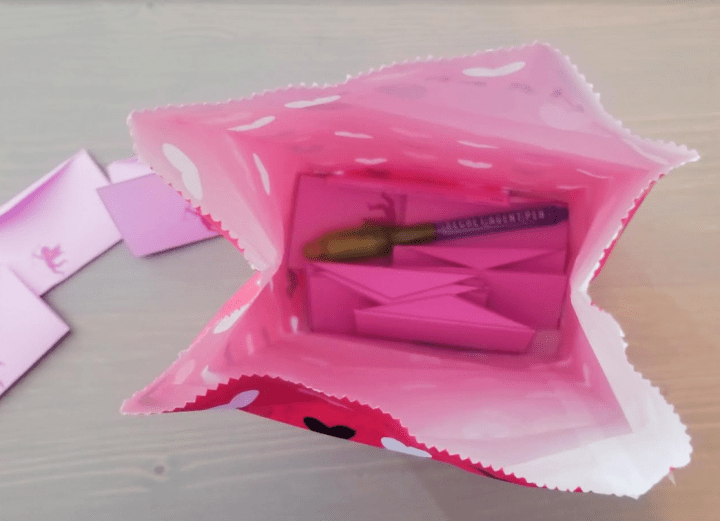escape room ideas shows a bag with valentines and a uv pen inside.