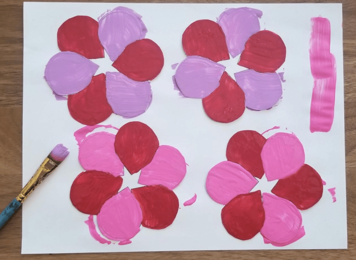 valentines for kids shows four hearts with painted petals.
