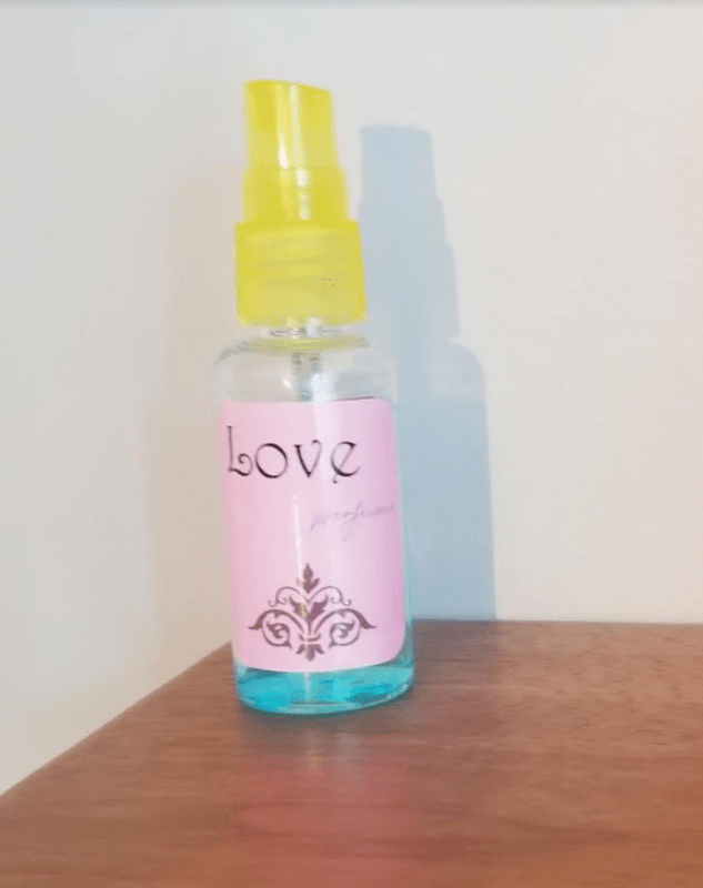 escape room ideas shows a small spray bottle with a label that says love perfume.