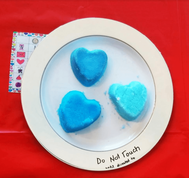 escape room ideas shows three blue hearts on a plate.
