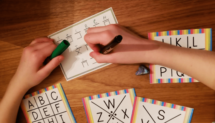diy escape room shows a child solving an alphabet code.