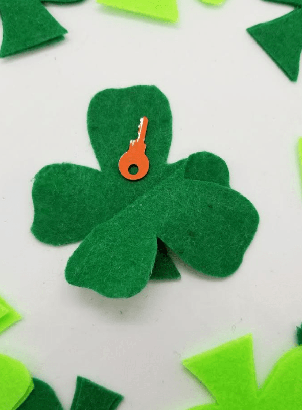 st. patrick's day escape room shows a shamrock opened with a key inside.