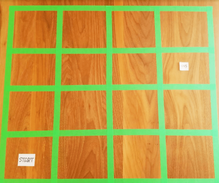 escape room puzzles shows a grid made from tape with START and a number in two squares.