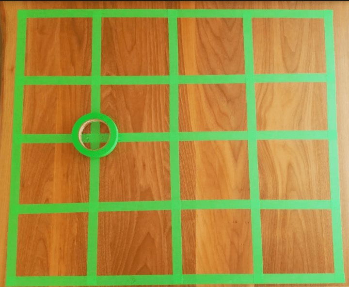 escape room puzzles shows a grid made from tape.