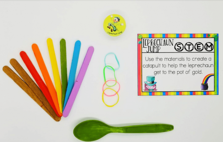 st. patricks day activity shows a task card, spoon, elastics and popsicle sticks.