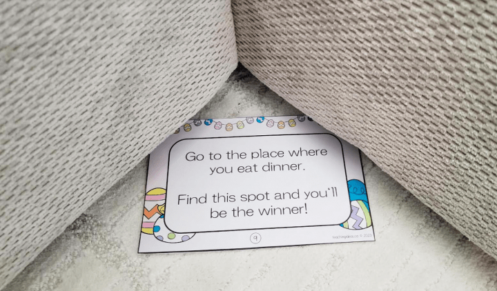 scavenger hunt for kids shows a couch corner with a note below that says go to the place where you eat dinner find this spot and you'll be the winner.
