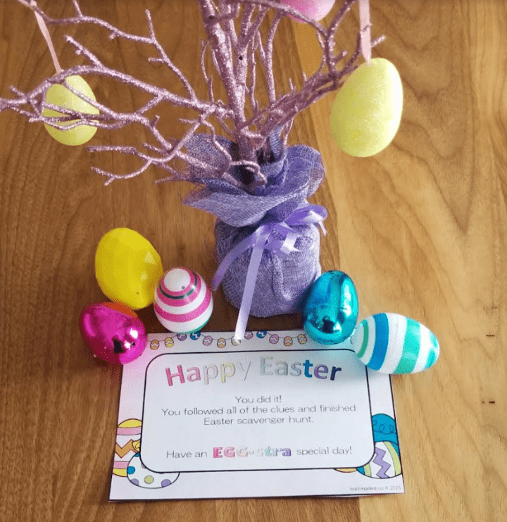 puzzle games for kids shows happy easter and a small purple tree with Easter eggs all around.