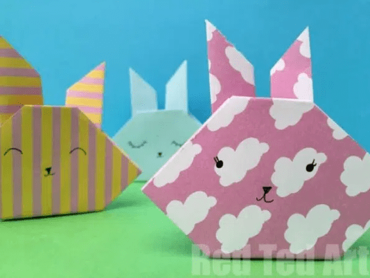 Easter craft shows a bunny face made from origami.