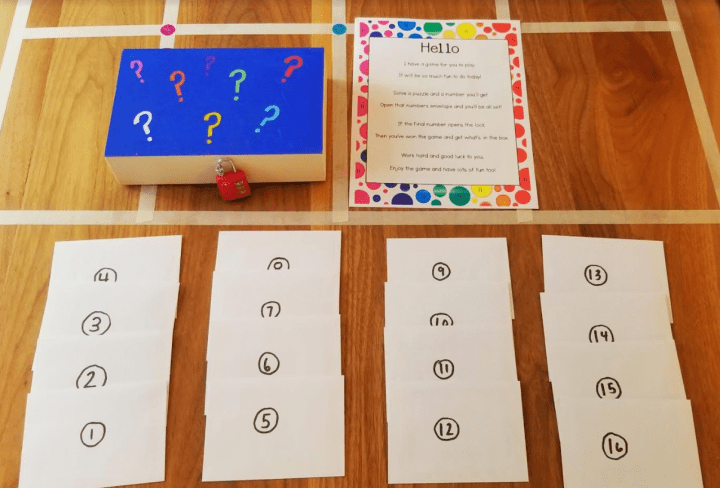 free printable escape room for young kids shows a locked box and 16 envelopes.