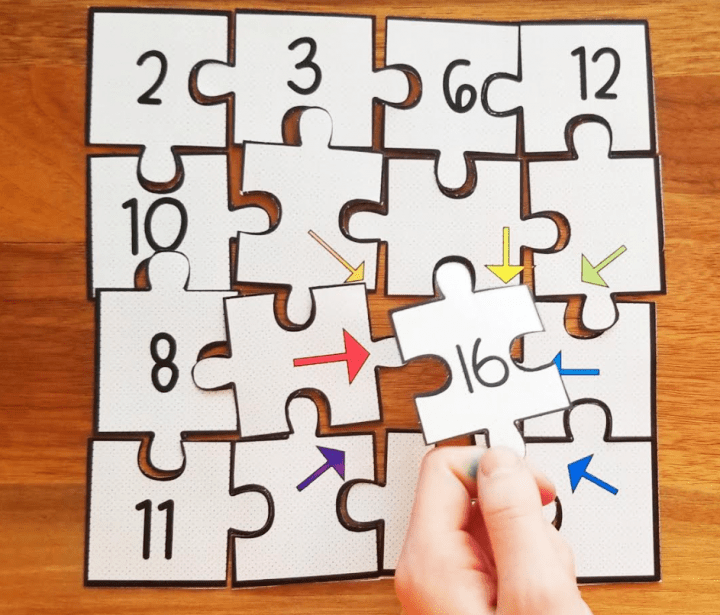 escape room game shows a child holding a puzzle piece with the number 16 on it.