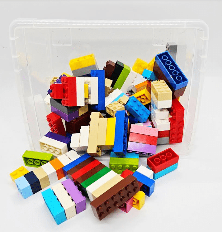 10 exciting STEM Activities shows a bin of plastic building blocks.