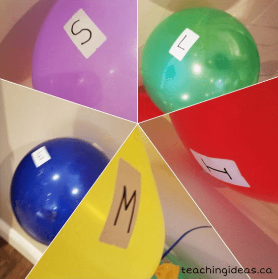 escape room ideas shows balloons with letters on them.