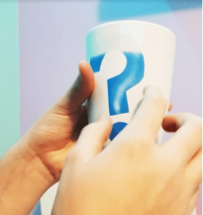escape room puzzle ideas shows a cup with an appearing blue question mark.