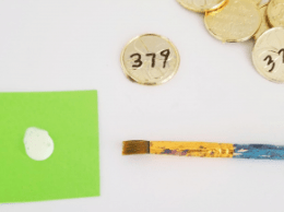 st patricks day escape room shows gold coins with numbers on them.