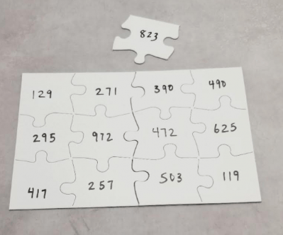 escape room puzzle ideas shows a puzzle with numbers on each piece and an extra.