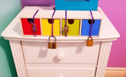 escape puzzle ideas shows a box with four boxes inside.  Each a different color and locked.