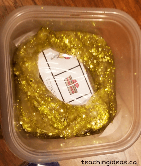 birthday party escape game shows gold glitter slime with a puzzle inside.