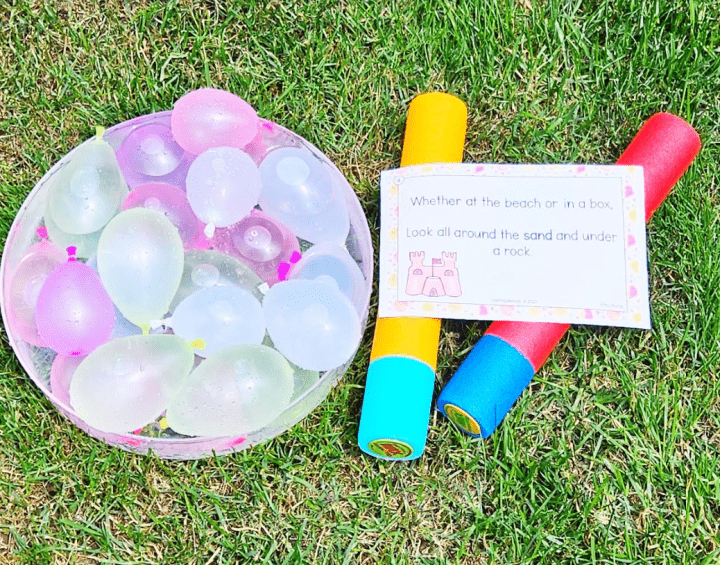 summer treasure hunt shows a bowl of water balloons and two water soakers.