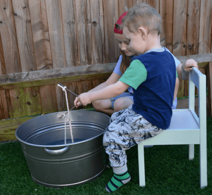 water stem for kids shows a small child fishing in a large tin bowl.
