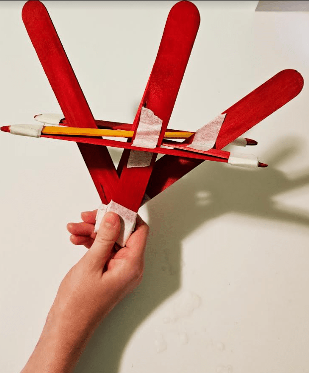 STEM popsicle sticks shows a red boat.