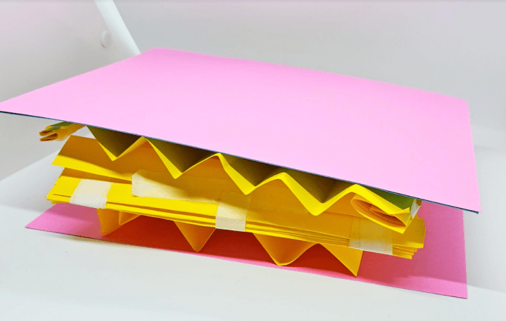 simple STEM shows a accordion folded paper with two flat sheets on top and bottom.