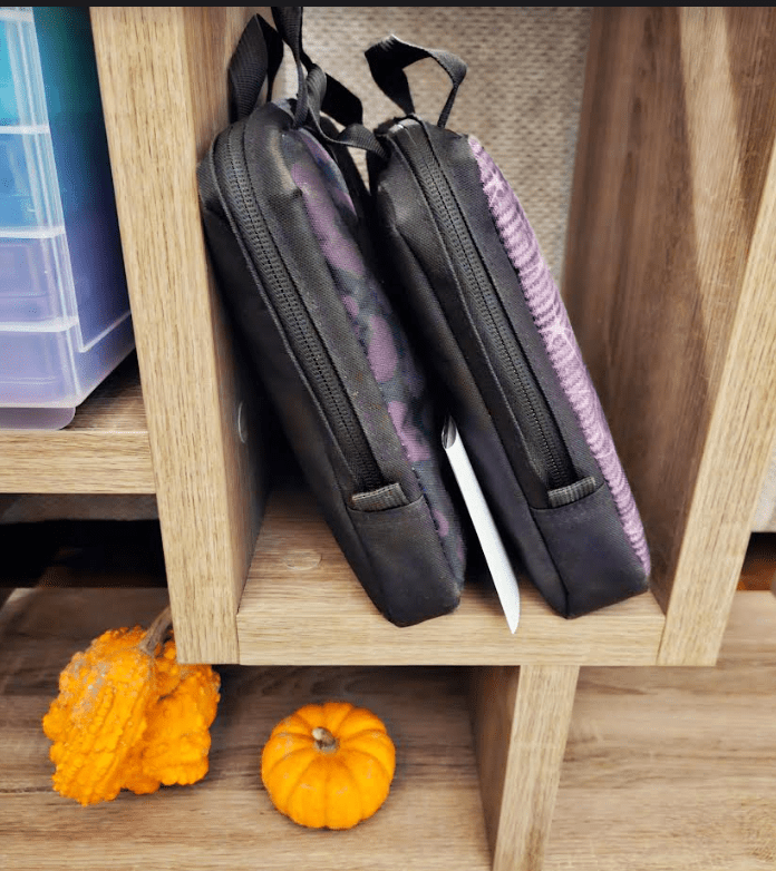 free classroom halloween scavenger hunt shows lunchpails on a shelf.
