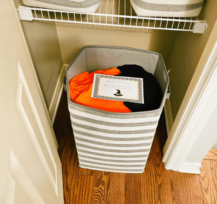 halloween activity for kids shows orange and black clothes in the laundry.