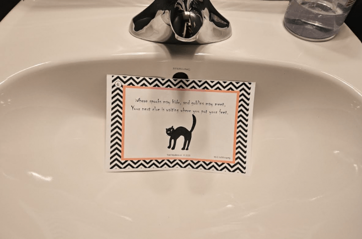 halloween activity for kids shows a clue in a sink.