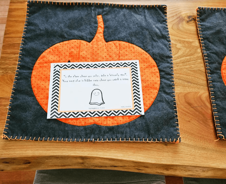 fall activity for kids shows a printed clue on a table cloth.