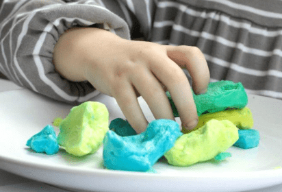 science for kids shows a child playing with frozen slime.