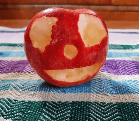 stem for kids shows an apple with eyes, nose and mouth cut out.