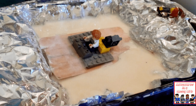 sensory for kids shows a tray with oobleck and lego.