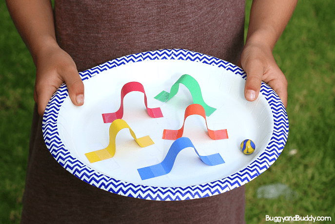 best stem activities for kids shows a maze on a plate with a marble.