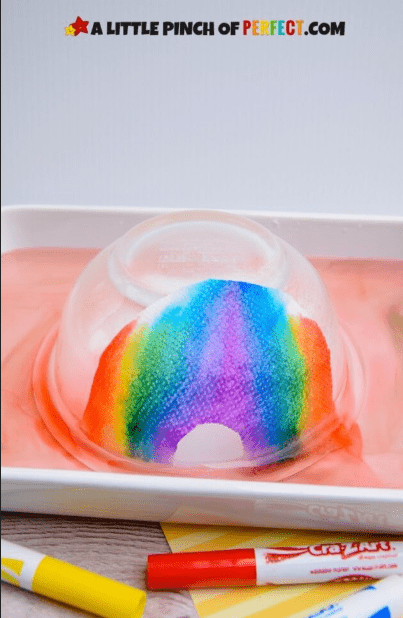 stem for kids shows a flipped bowl with a rainbow on a paper towel.