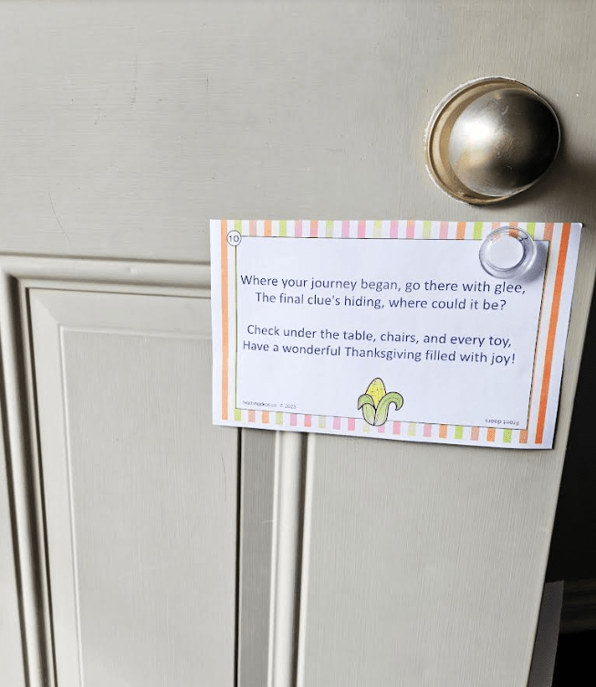free printable thanksgiving scavenger hunt  shows a printed clue on a door.