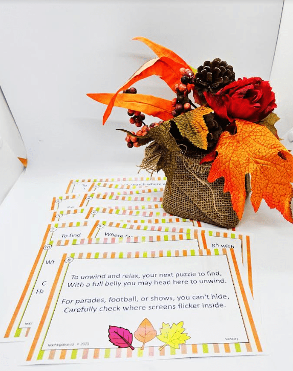 free printable thanksgiving scavenger hunt shows a stack of printable riddles and a thanksgiving decoration.