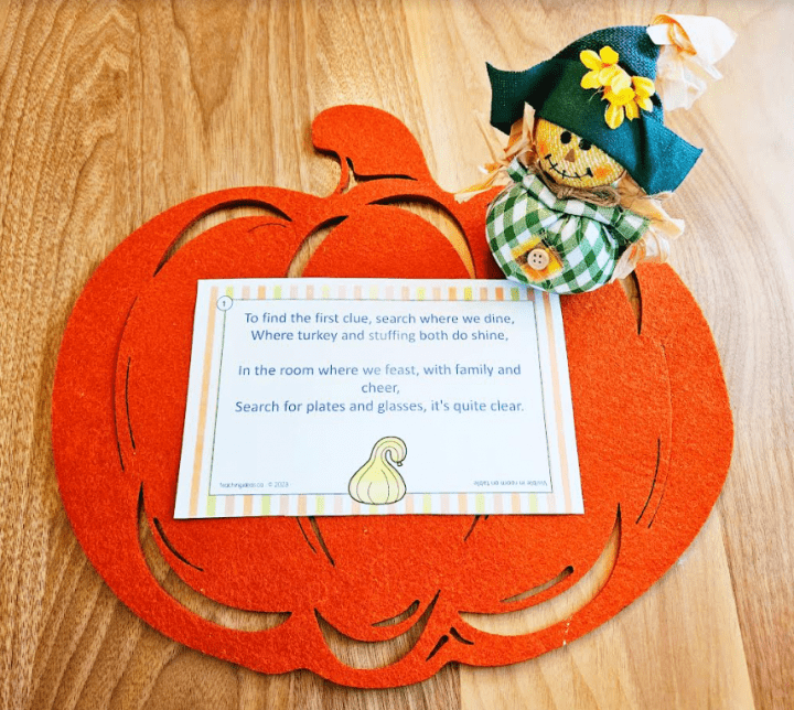 free printable thanksgiving scavenger hunt shows a pumpkin mat, decoration and clue.
