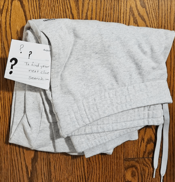 DIY escape room ideas shows a pair of pants with a clue sticking out of the pocket.