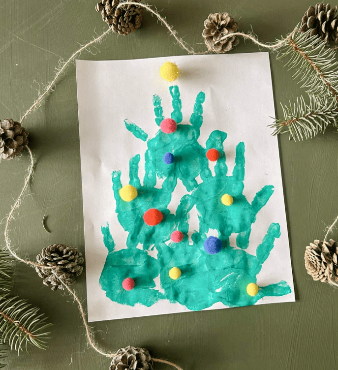 preschool christmas tree made from green painted hand prints.
