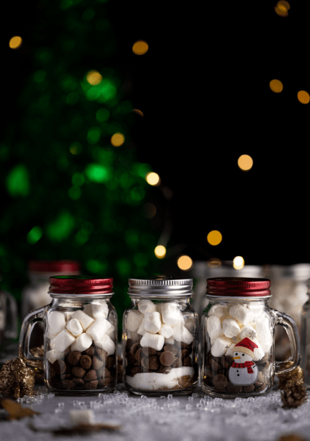 holiday craft ideas shows three containers with everything you need for hot chocolate.