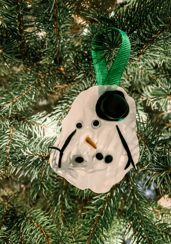 kindergarten christmas crafts shows a melted snowman ornament.