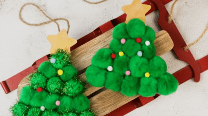 preschool christmas craft shows two pom pom christmas trees.