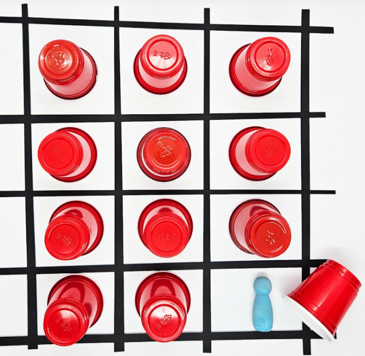 breakout game for kids shows a grid and red cups in each square.
