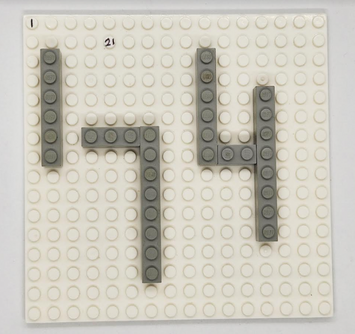 DIY escape room puzzles shows a lego piece with the number 174 created on it.