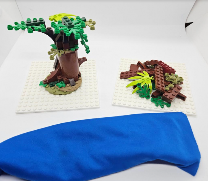 puzzles for kids shows a completed lego tree and a pile of pieces to make a lego tree.