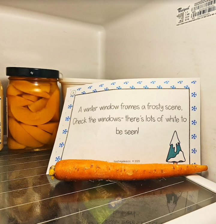 winter scavenger hunt shows a printed clue with a carrot in a fridge.