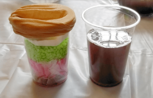 nature STEM shows two cups. One with dirty water.