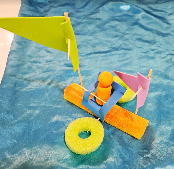 easy stem challenge shows a DIY boat on a fabric sheet.